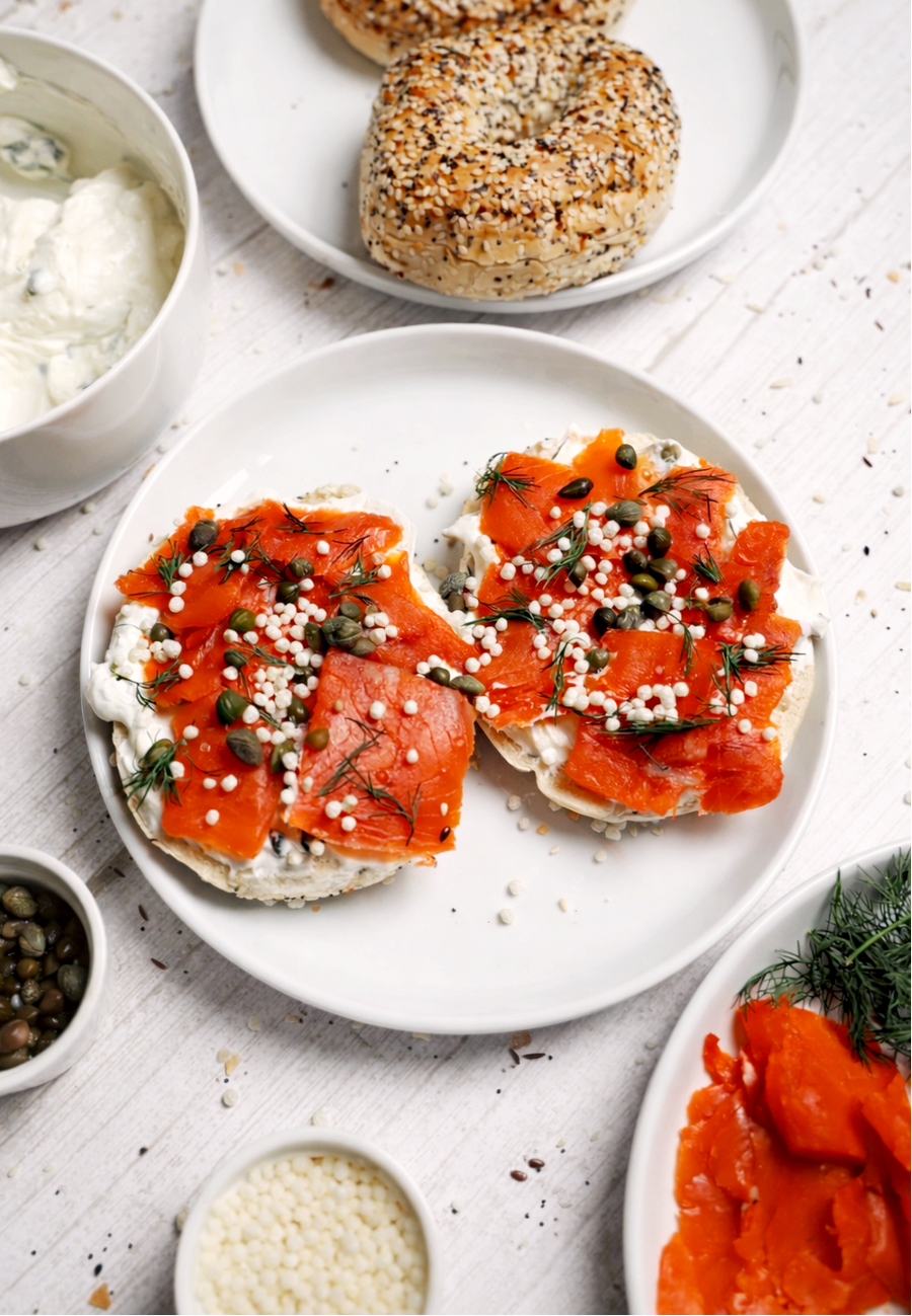Everything bagel with cream cheese, smoked salmon, capers, and dill topped with LIFTER Crispies